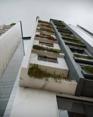 There are protrusions and depressions on the façade of the building to make it look more attractive, which has affected the dining room wall and the terrace as well as the area of each floor
